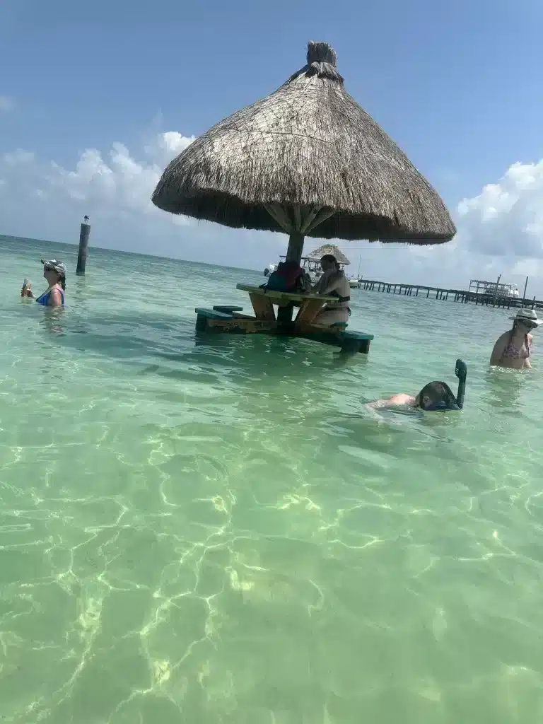 Snorkeling while waiting for lunch is perfect with family for your Caye Caulker, Belize itinerary. 