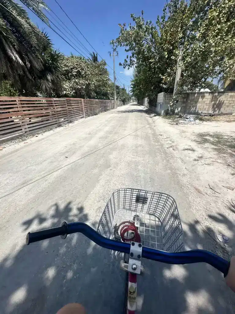 Biking in Caye Caulker, one of the best ways to get to town from our oceanfront rental.