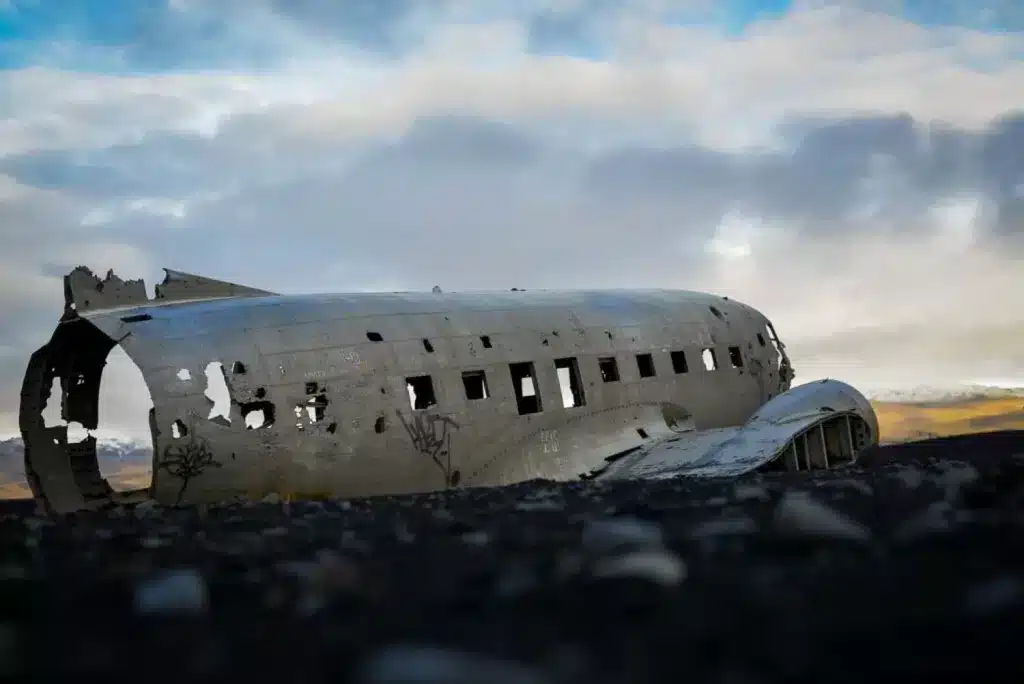 A plane wreck in Iceland is a great addition to your itinerary but be sure to have waterproof hiking gear on your packing list, as it's a long walk out.