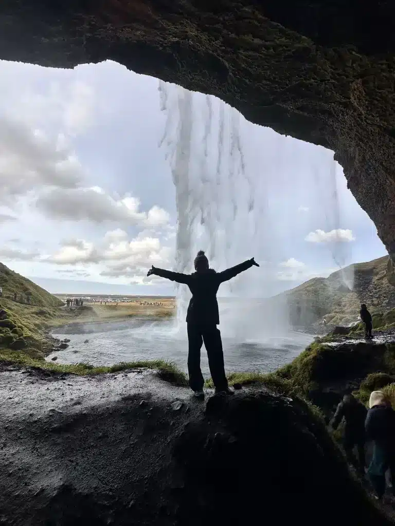 Walking behind Seljalandsfoss waterfall in Iceland and you will want waterproof gear to wear.