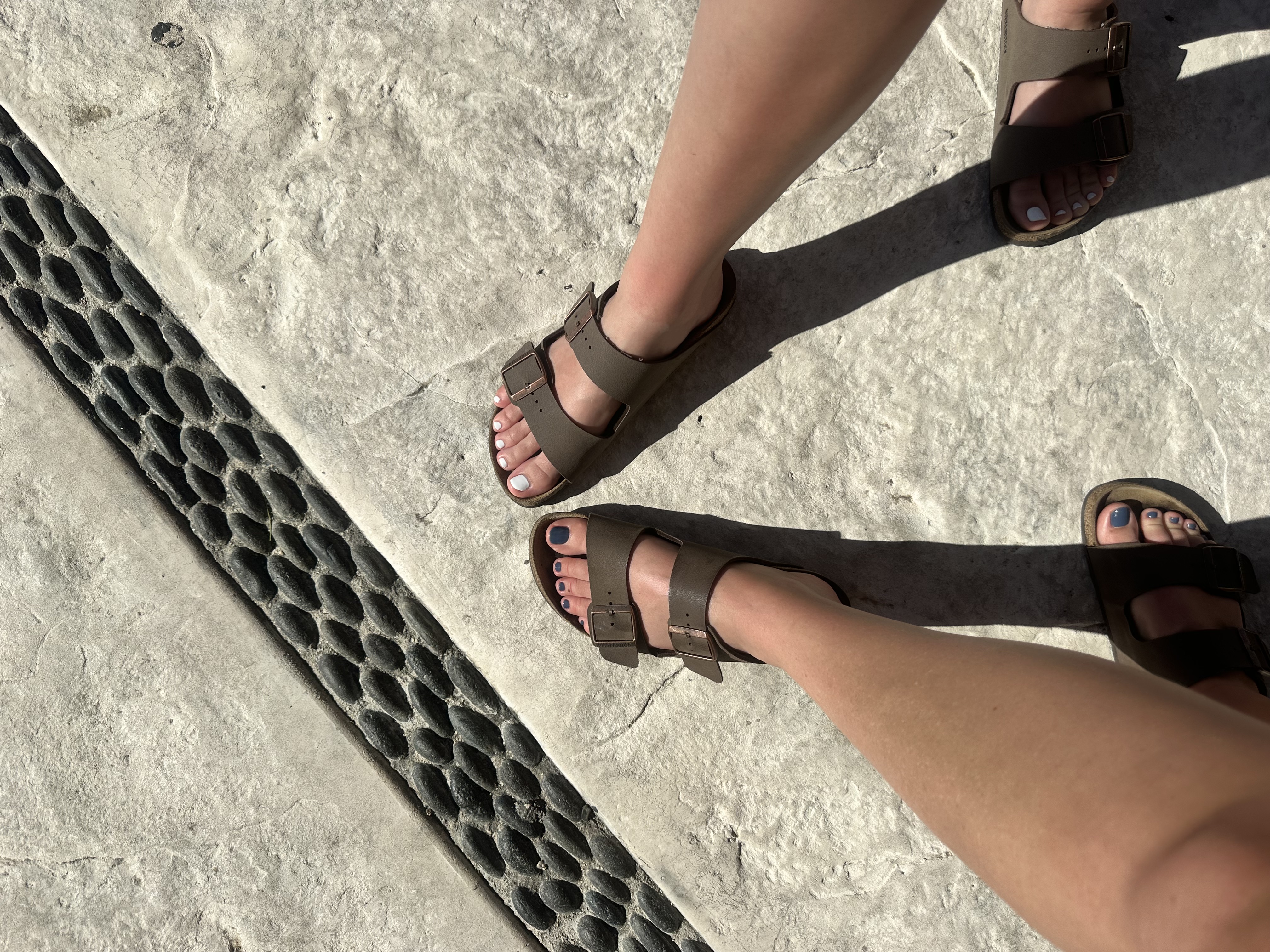 Showing off our toes after our mani and pedi at the spa of Villa Del Palmar.