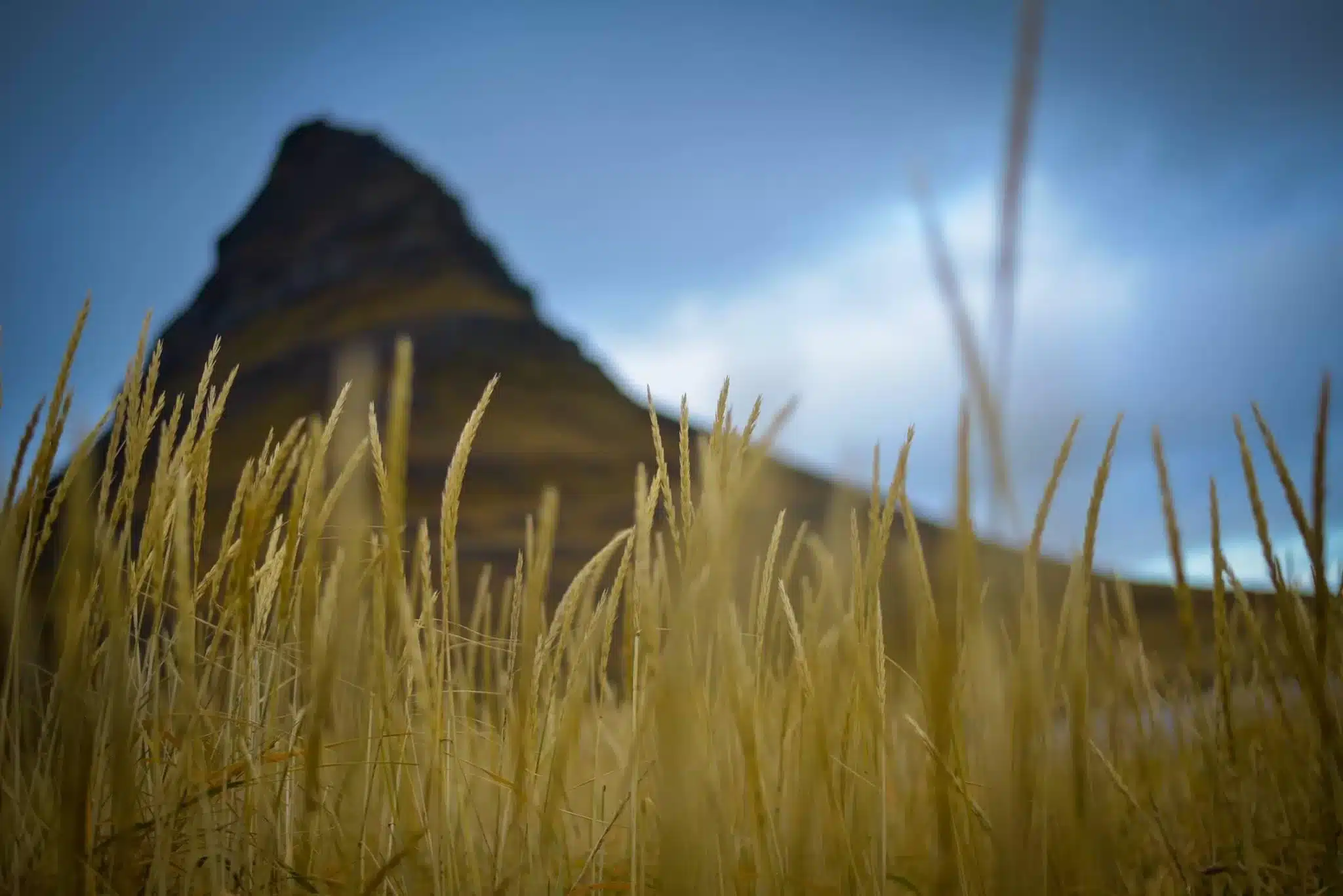 Kirkjufell mountain on Snaefellsnes Peninsula in Iceland is an iconic sight when traveling to Iceland.